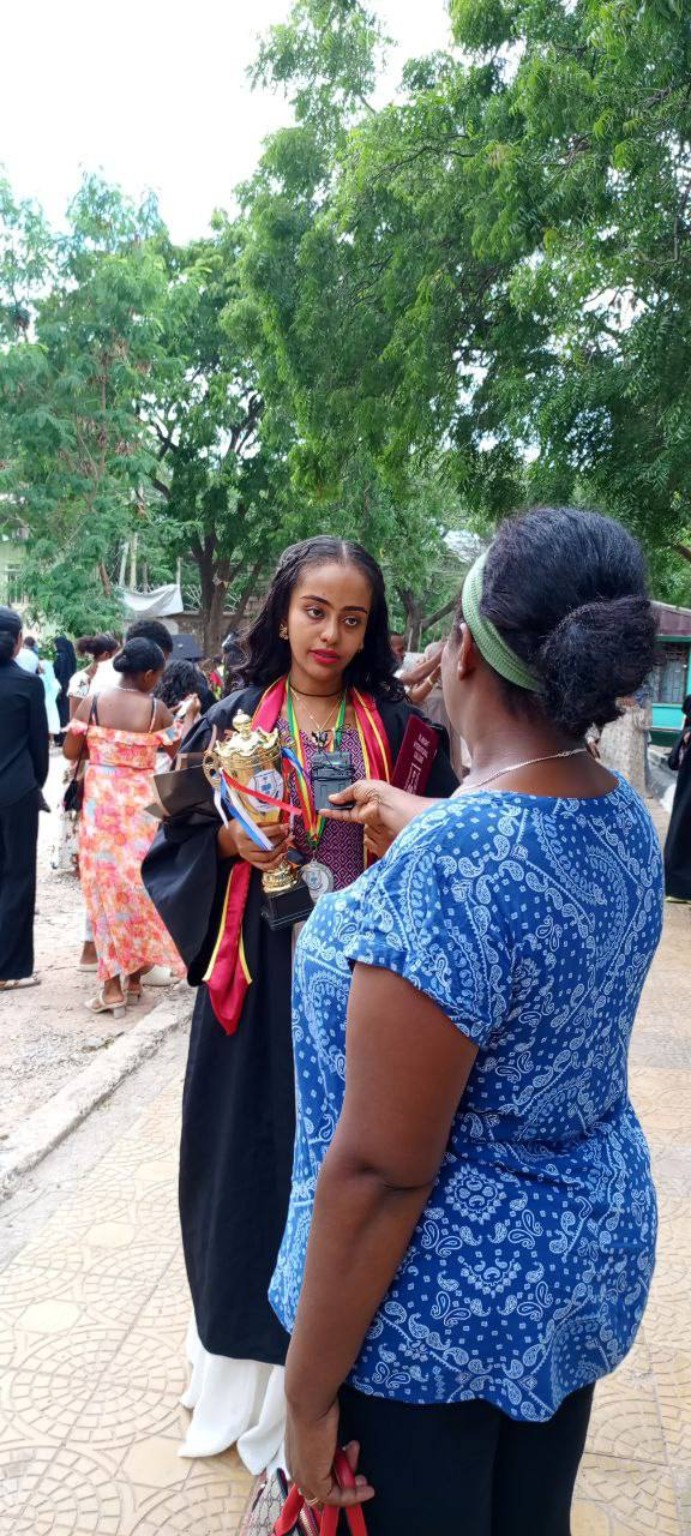 Ol-Bright graduate receiving recognition during a ceremony
