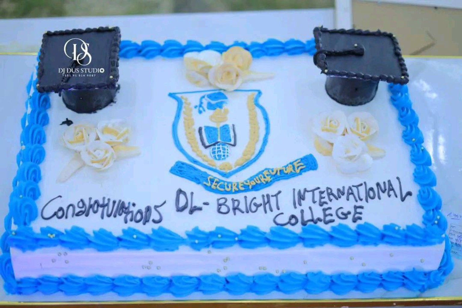 Celebration cake with the Ol-Bright International College emblem