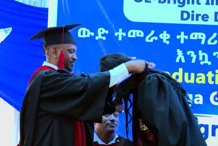 A graduate receives a medal