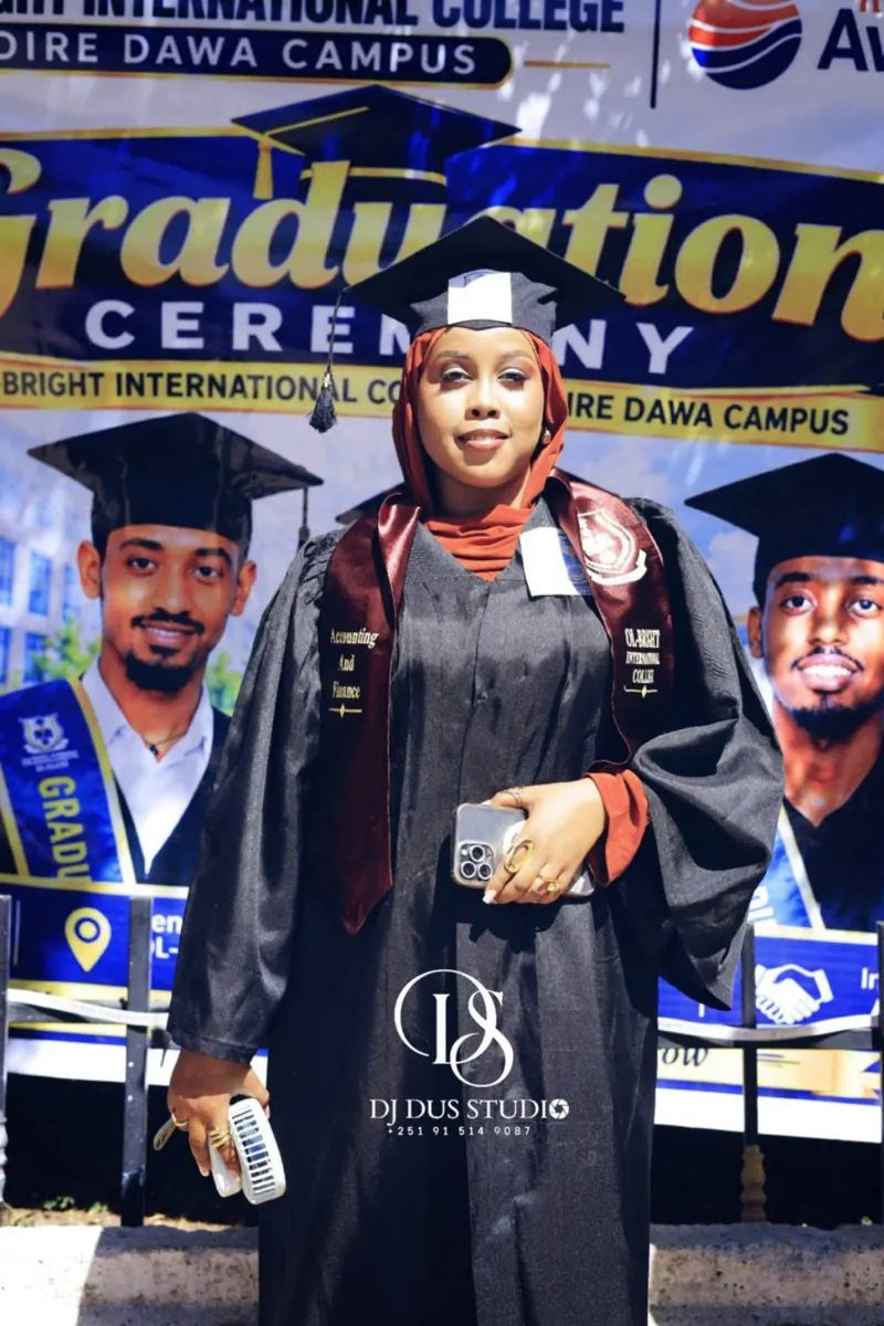 A woman graduate celebrates her achievement