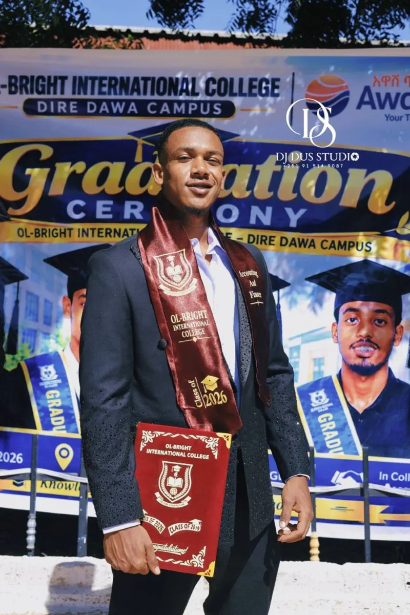 A graduate displays his Ol-Bright graduation stole