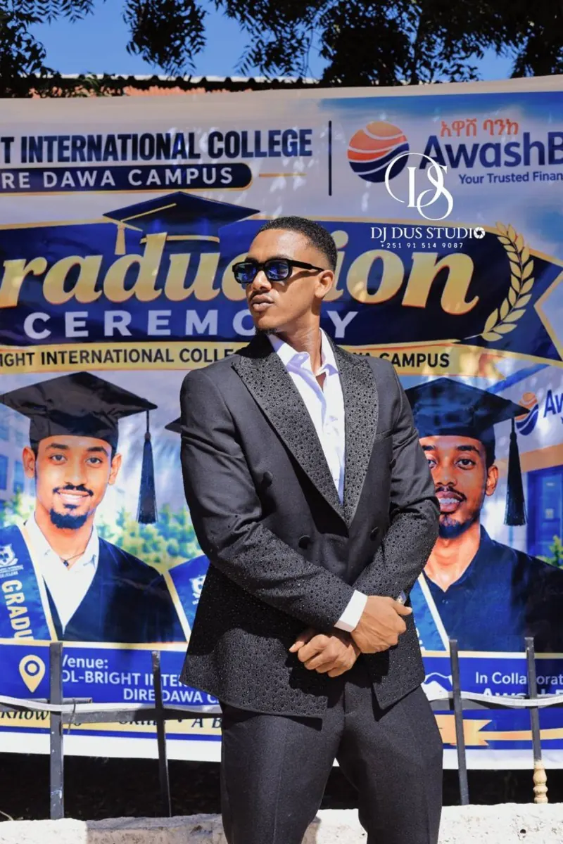 A guest celebrates at the graduation photo area