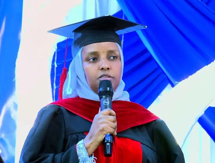 A speaker addresses the graduation ceremony